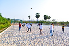 Enjoy beach volleyball and more at USM Infra Go Ranch Resort. Purchase a plot and receive free membership, offering exclusive access to resort amenities and activities.