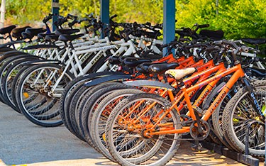 Cycle stands at USM Infra Go Ranch, designed for convenience and accessibility. Explore our DTCP approved farm plots near Hyderabad