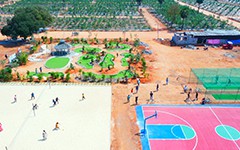 Discover the Play Area at USM Infra Go Ranch Resort Sandalwood Farm Plots. A perfect spot for families, offering a safe and fun environment for children surrounded by the peaceful sandalwood farm plots near Hyderabad.