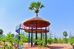 Enjoy a unique tree deck experience surrounded by lush sandalwood nature at USM Infra Go Ranch. A serene and immersive way to connect with nature.